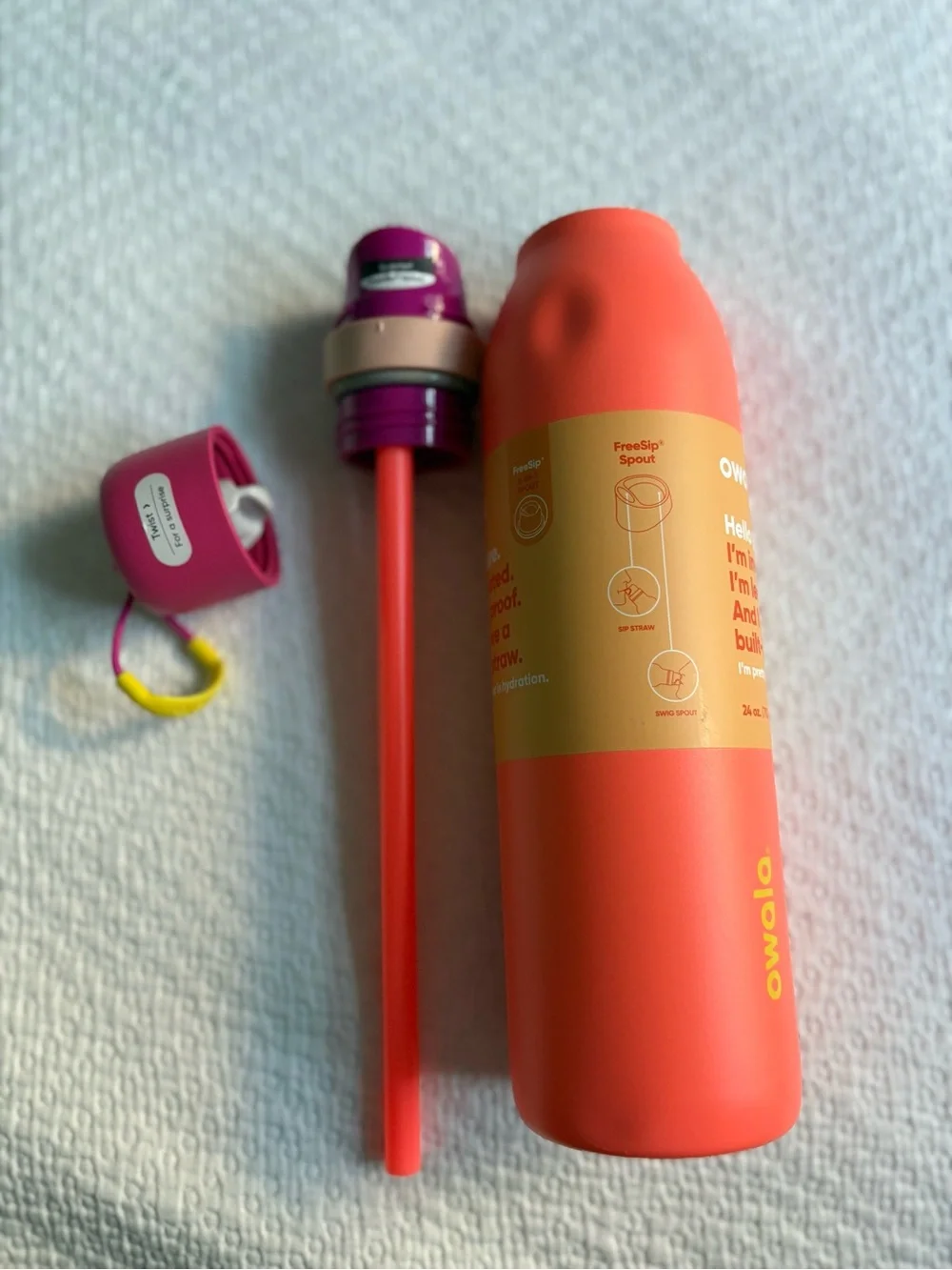 Owala Insulated Water Bottle in Coral with Pink Cap